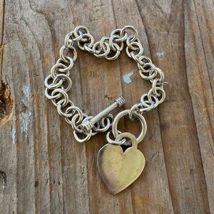 Large link Sterling Heart charm bracelet with toggle clasp. Measures 7 inches.